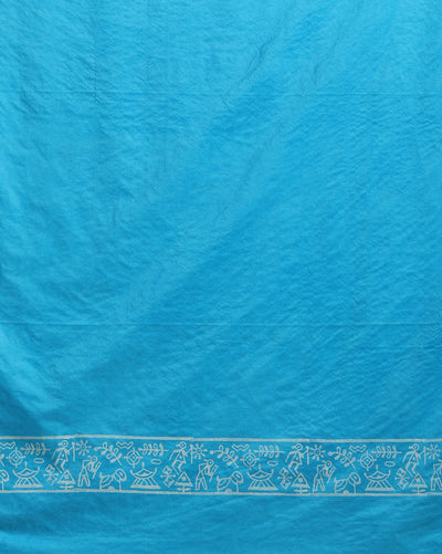 Sky blue Katan silk unstitched suit set block printed with tribal figures and circular mandalas in bright and light blue on the top piece, a dupatta bordered with linear geometric bands, and a plain bottom piece.