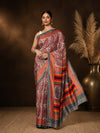 Red, white and grey paisley printed saree with multi-coloured horizontal striped borders, styled with a reference blouse.