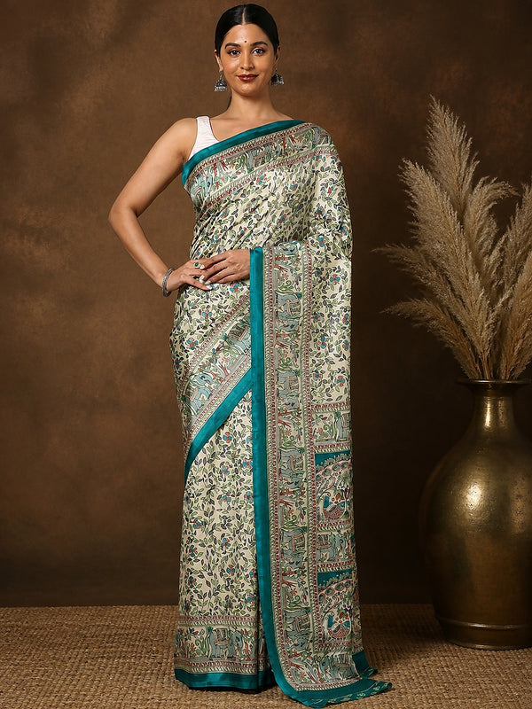 Off White and teal printed Kashmiri silk saree with a fine kalamkari-style figurative print of florals, elephants and peacocks, and a wide teal border of repeating elephants and birds.