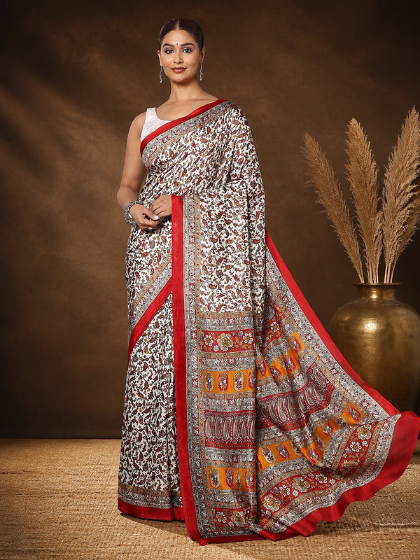 White and red paisley and floral printed saree with a wide mustard, red and white banded pallu, styled with a reference blouse.