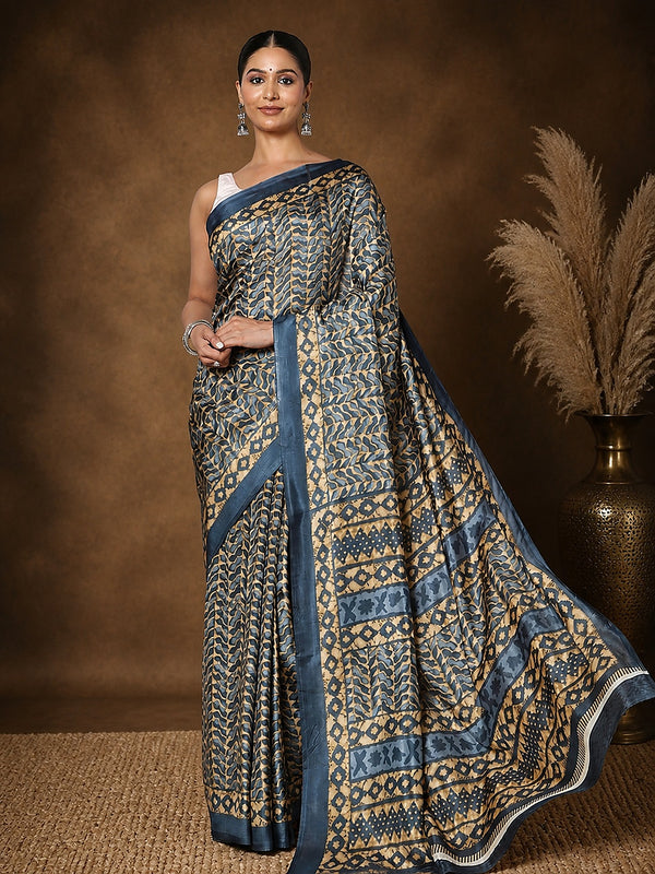 Dark blue and tan printed saree with geometric, leaf-like motifs and a dark blue border, styled with a reference blouse.