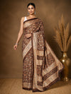Dark brown Kashmiri Silk printed saree with an all-over paisley and floral print in cream, burnt orange and muted gold, a block-panelled pallu and a dark-brown border with a lighter inner trim.