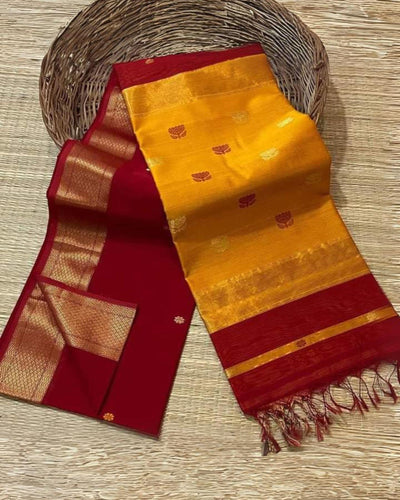 Handloom Maheshwari silk saree, mustard yellow body with flower buti, deep maroon pallu with lotus buti and a golden zari border