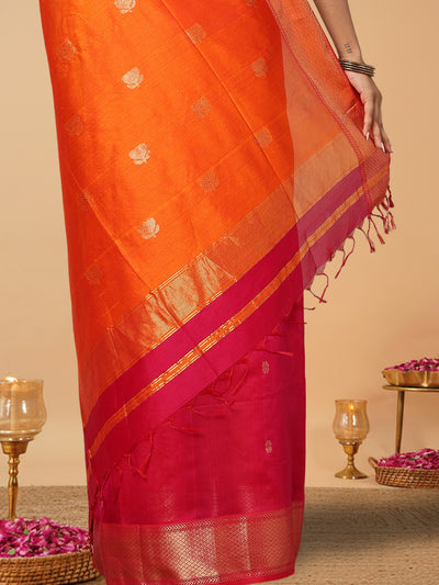 Handloom Maheshwari silk saree, fuchsia body with flower buti, orange pallu with lotus buti and a golden zari border