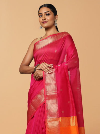 Handloom Maheshwari silk saree, fuchsia body with flower buti, orange pallu with lotus buti and a golden zari border